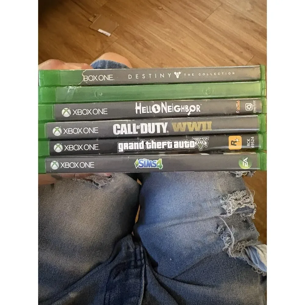 6 Xbox One games with a red wireless controller.